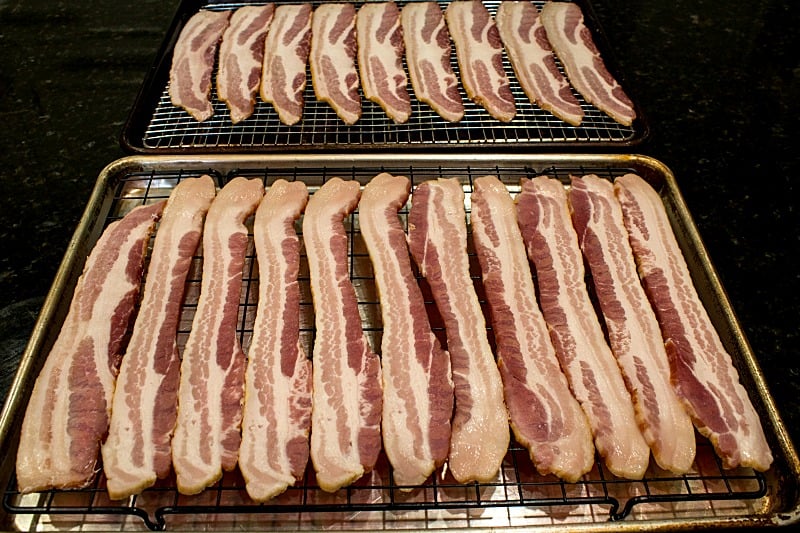 Raw bacon on wire rack for the oven.